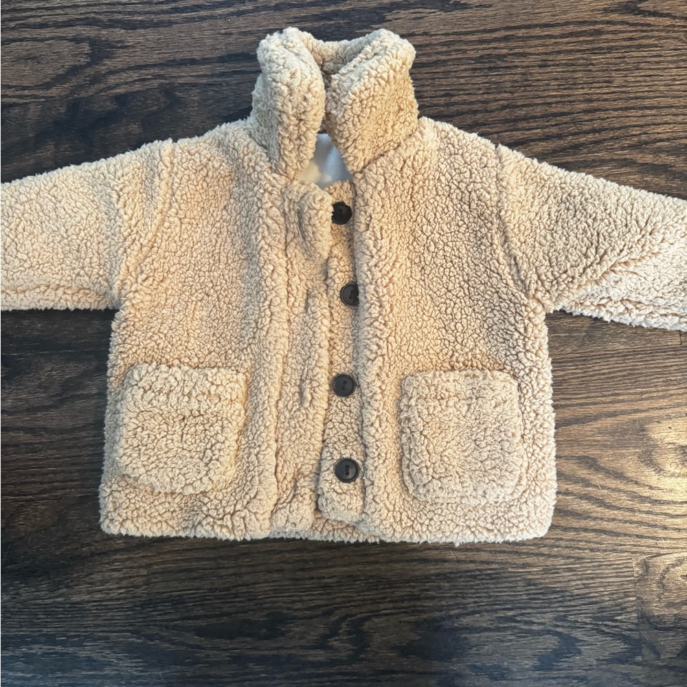 Tan Puffer Coat with High Collar and Cozy Texture